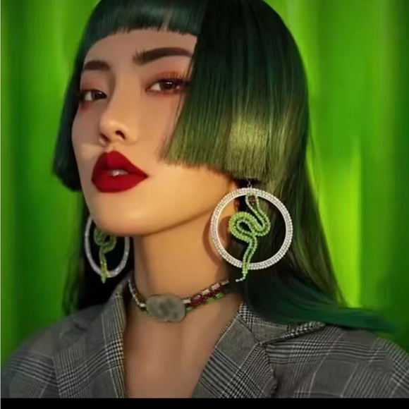 These are glamorous snake-themed hoop earrings with rhinestones. - Picture 2 of 3